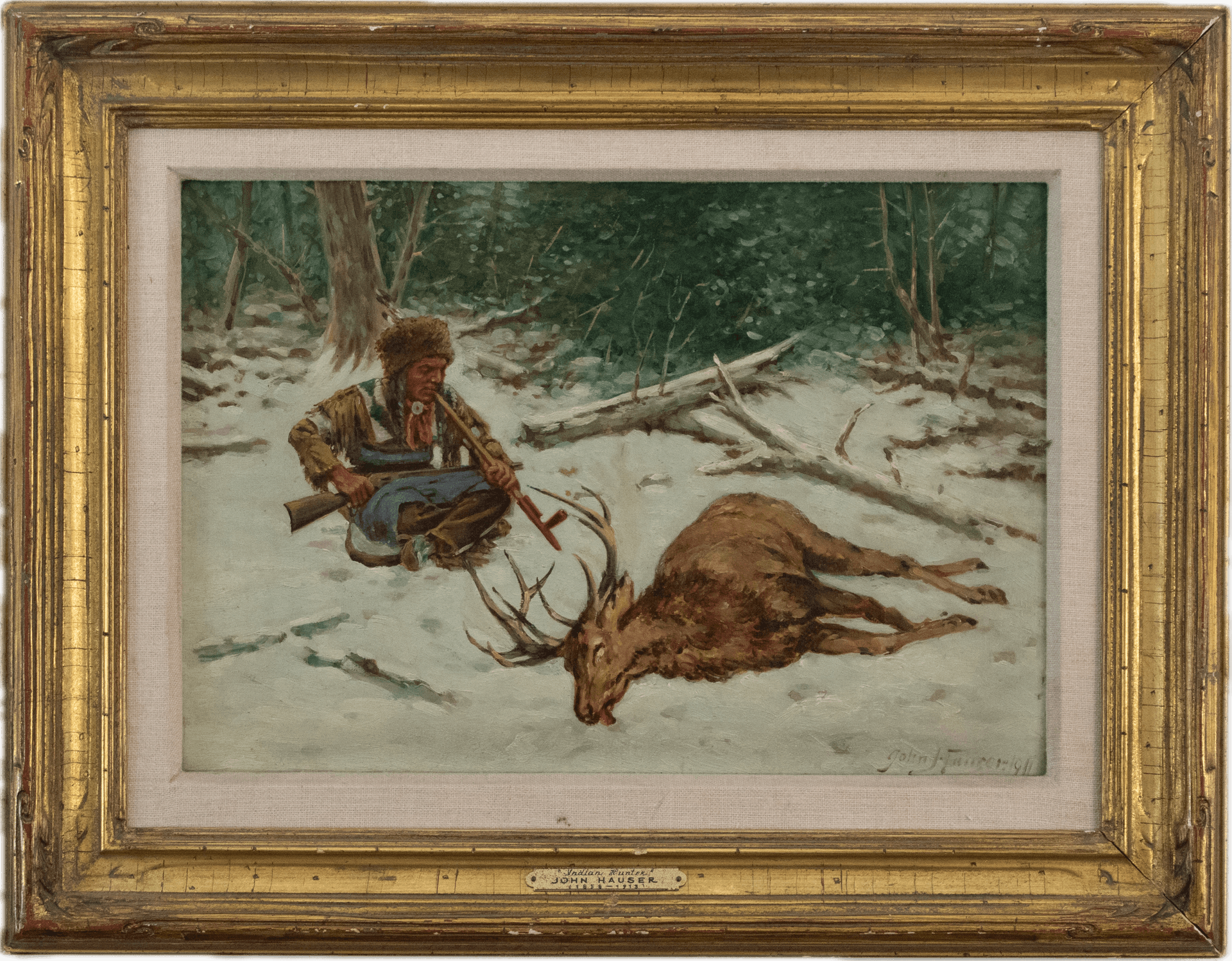 A Native American hunter in traditional buckskin clothing seated in snow beside a felled elk, with winter forest behind, painted in the detailed narrative style of Western American genre painting.